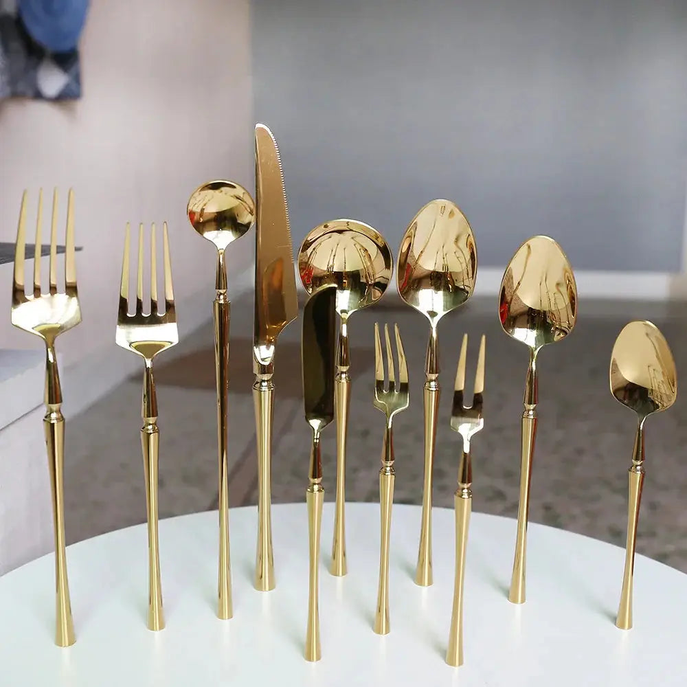 Modern 4-piece stainless steel steak cutlery set with golden polished finish and sleek modern design