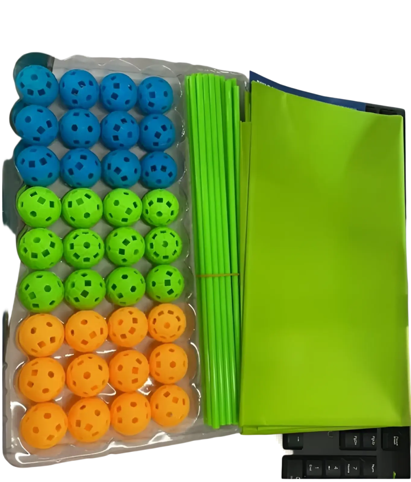 Brightly colored plastic balls in blue green and orange with perforated patterns arranged with neon green sticks in fort building kit glow in the dark kids tent set