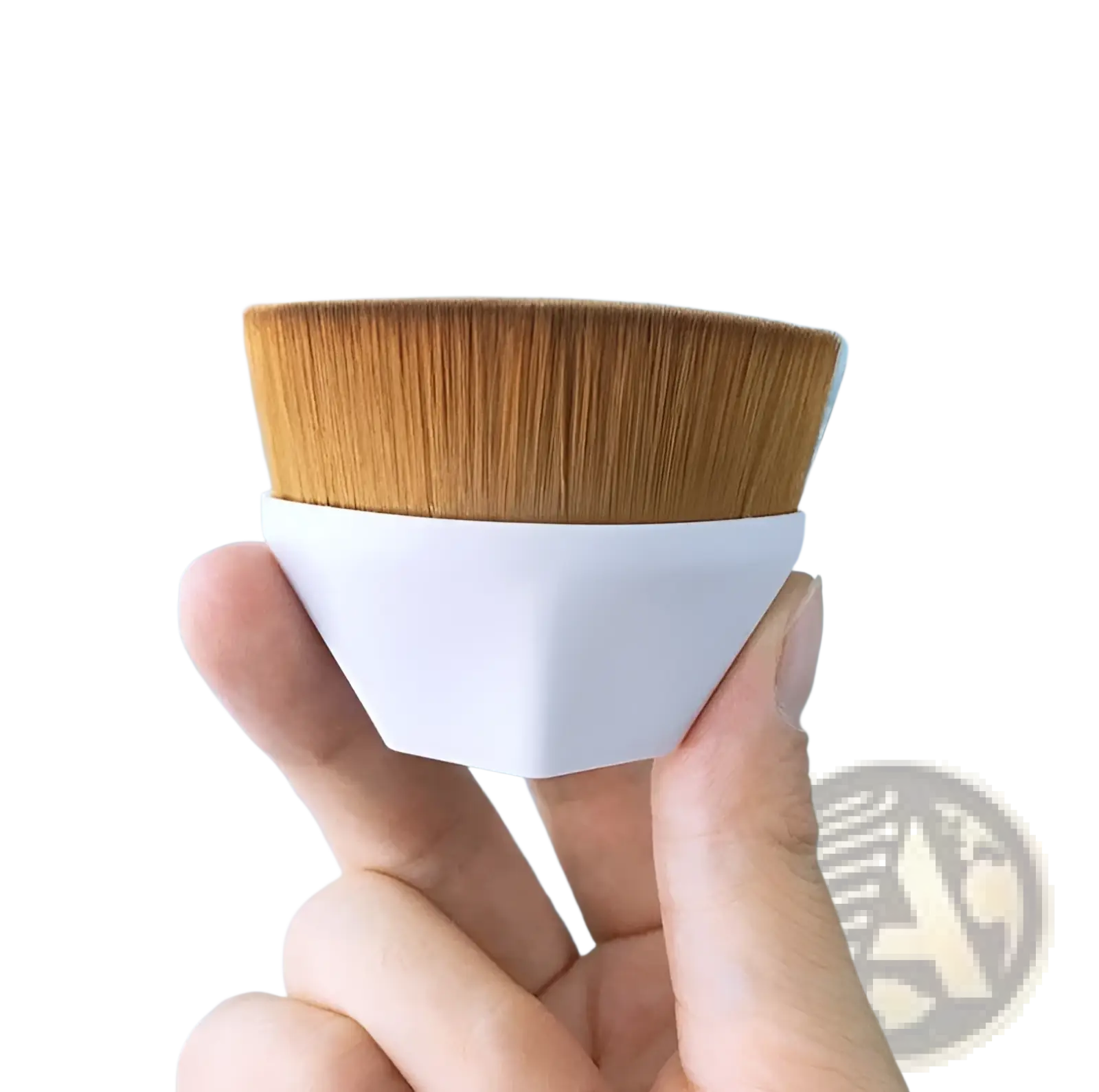 A sleek white hexagonal foundation brush with dense golden-brown bristles for powder makeup application