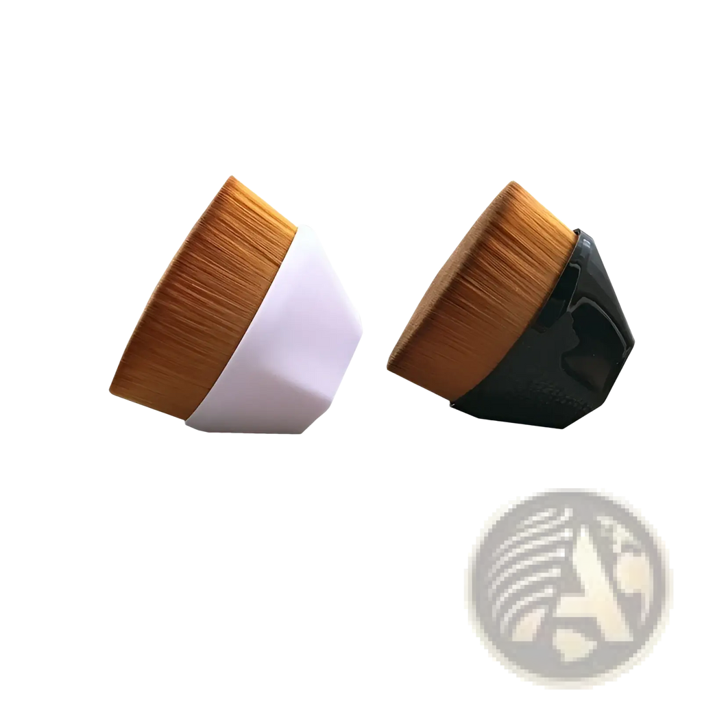 Two angled foundation brushes with dense golden brown bristles and sleek white and black plastic handles for makeup application