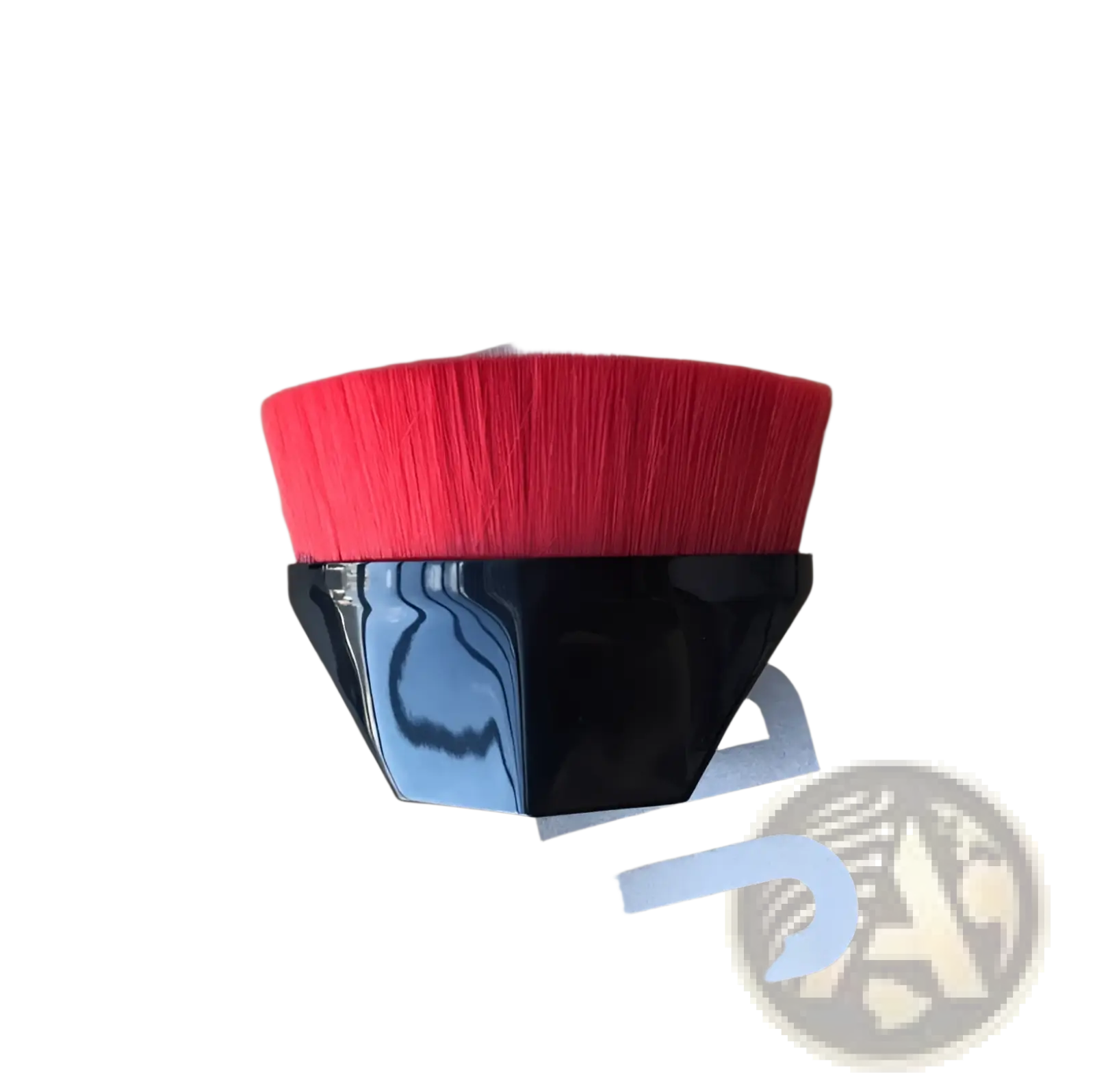 A sleek black-handled foundation brush with vibrant red bristles and a modern geometric design for powder makeup