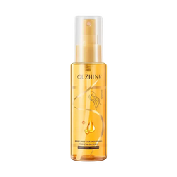 Golden transparent bottle of ouzhini fragrance hair care essential oil spray with gold-tone nozzle and elegant design 100ml