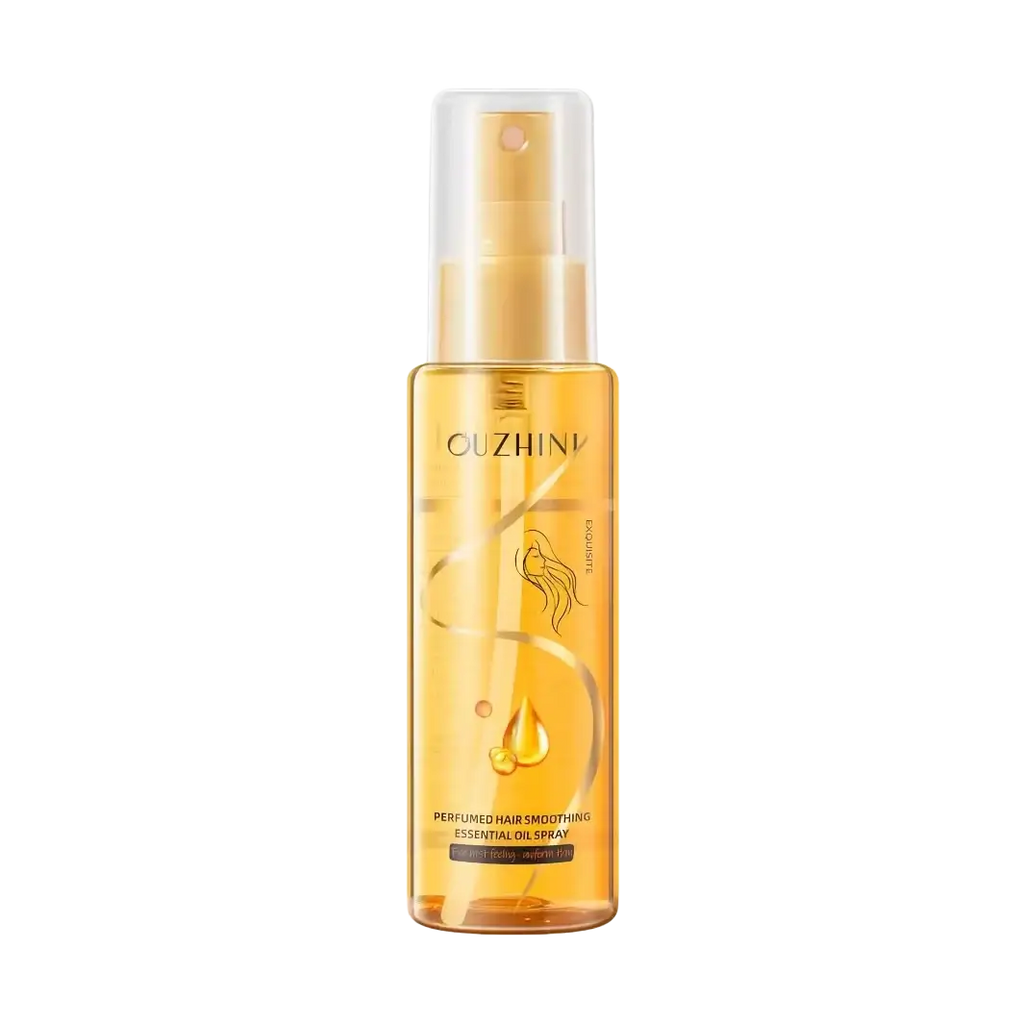 A transparent amber glass bottle with gold-tone spray nozzle labeled ouzhin fragrance hair care essential oil spray 100ml