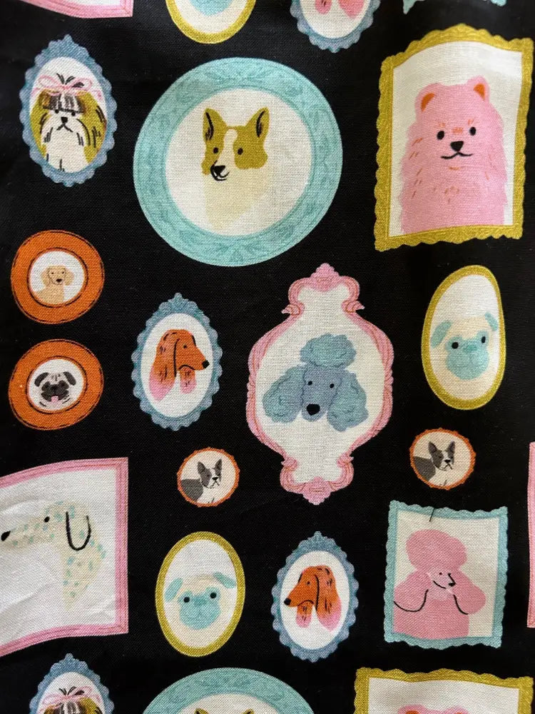 Black cotton vintage framed cartoon dog a-line skirt featuring pastel oval and rectangular borders with playful dogs