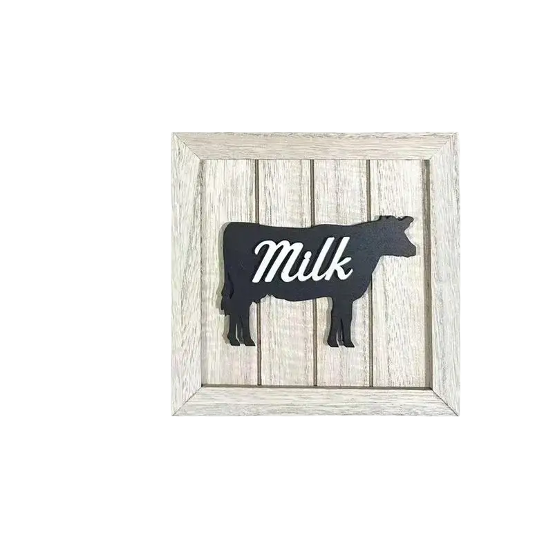 Black cow-shaped wooden framed wall art with white milk script in distressed whitewashed wood frame kitchen decor