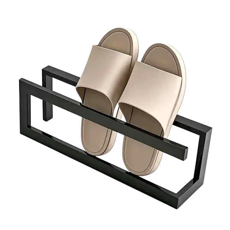 Beige slip-on sandals resting on a sleek freestanding metal shoe rack space saving holder in black finish