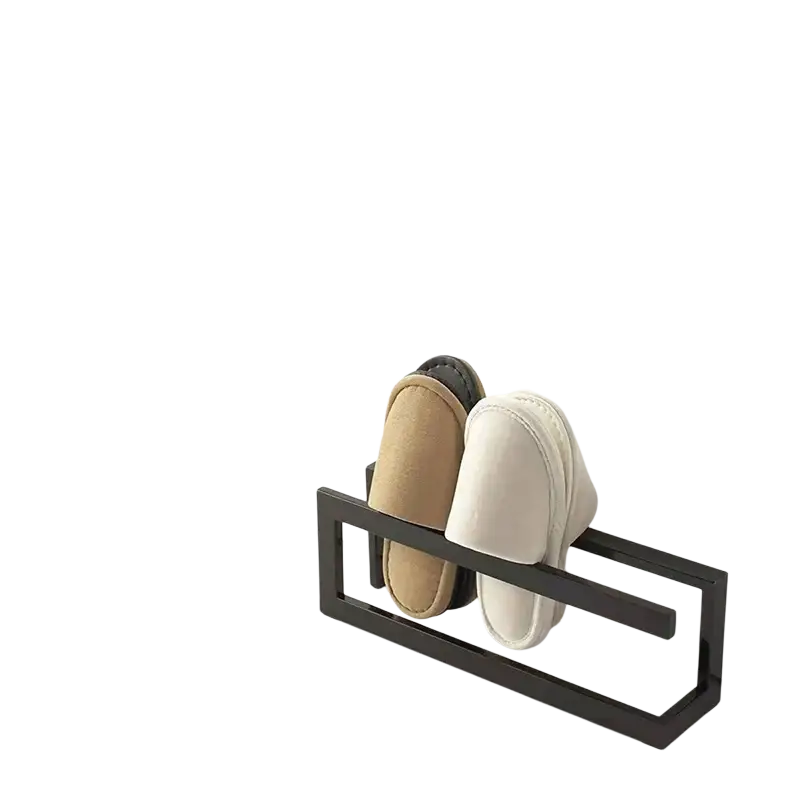 Black metal freestanding shoe rack holding beige and white slippers for space saving shoe organization