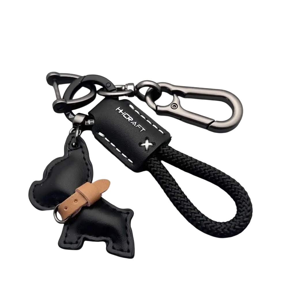 Black leather French Bulldog keychain with braided cord, metal carabiner clips, and tan leather dog charm