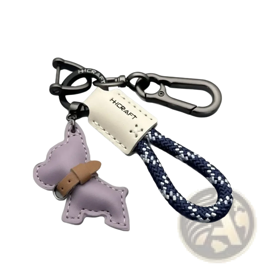French bulldog leather keychain in purple with tan collar detail attached to navy and white braided rope strap