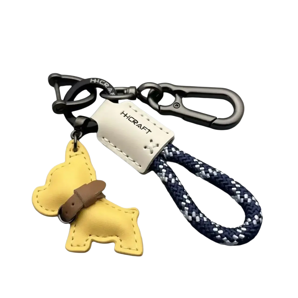 Yellow leather french bulldog keychain with brown strap and navy blue braided rope attachment