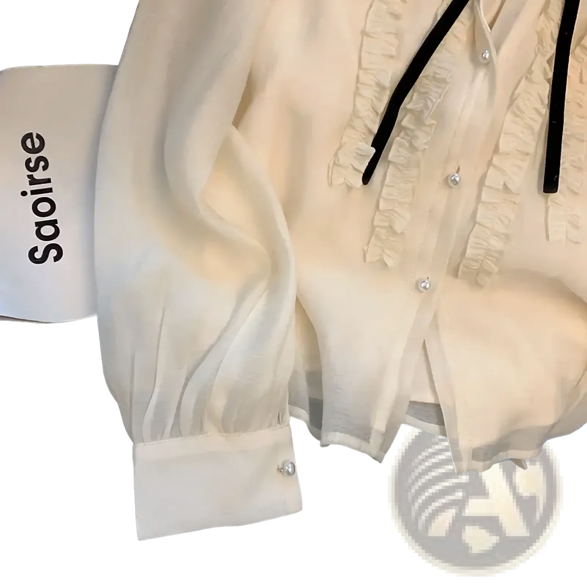 French chic lace bow tie blouse is an off-white sheer blouse with ruffles and pearl buttons on front and cuffs