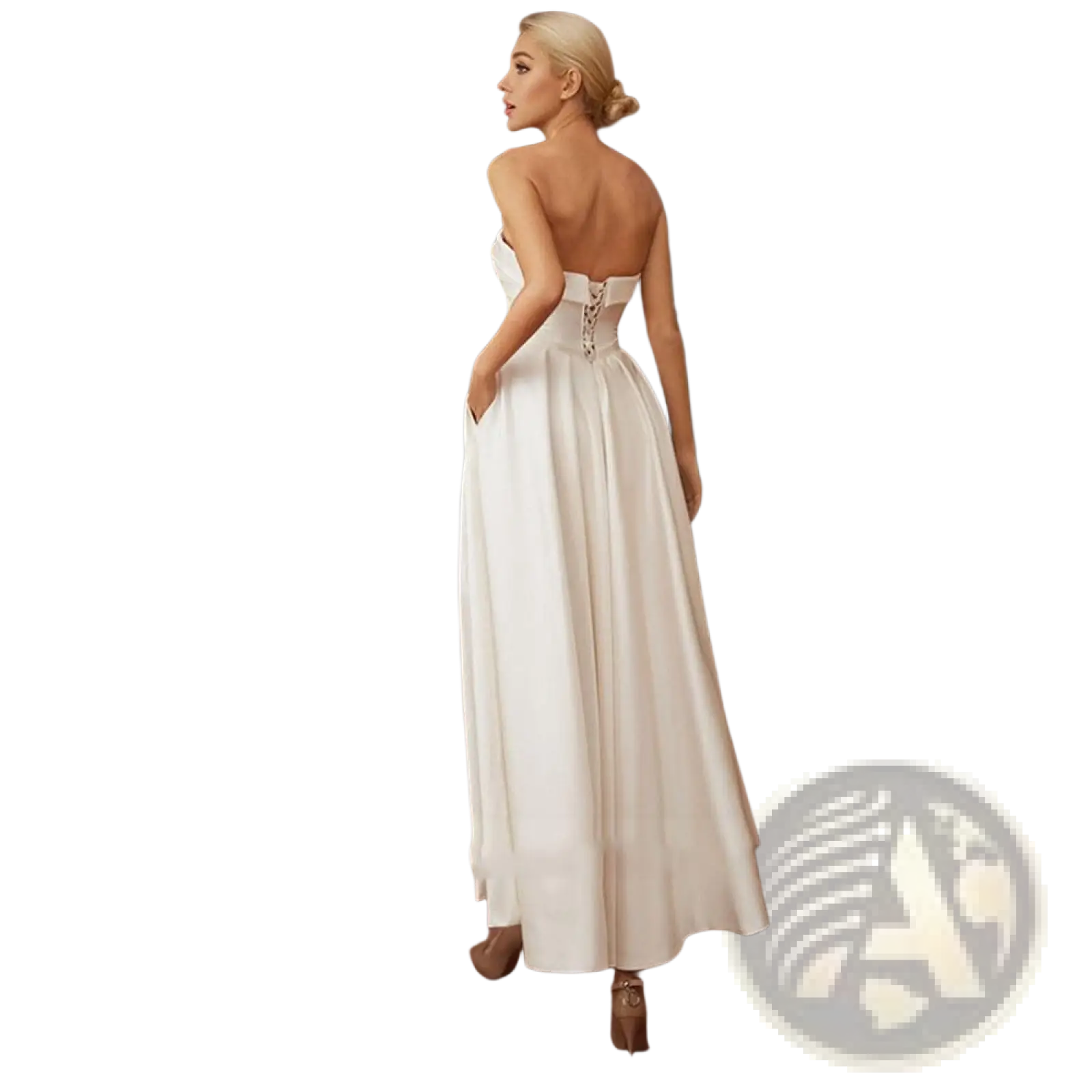 Back view of a flowing white satin strapless midi wedding and evening gown with corset detail and high slit
