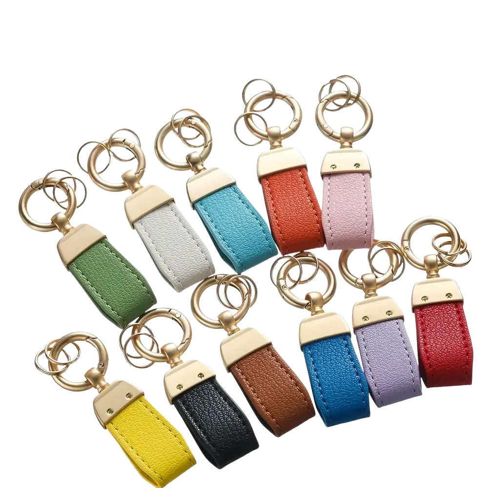 A collection of colorful french sheepskin leather car keychain pendants with gold-tone metal hardware