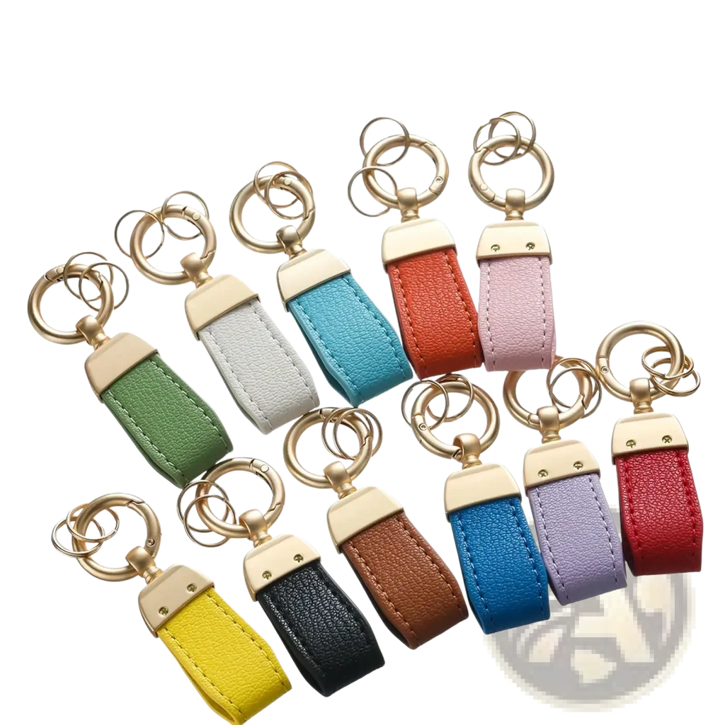 A collection of colorful french sheepskin leather car keychain pendants with gold-tone metal hardware