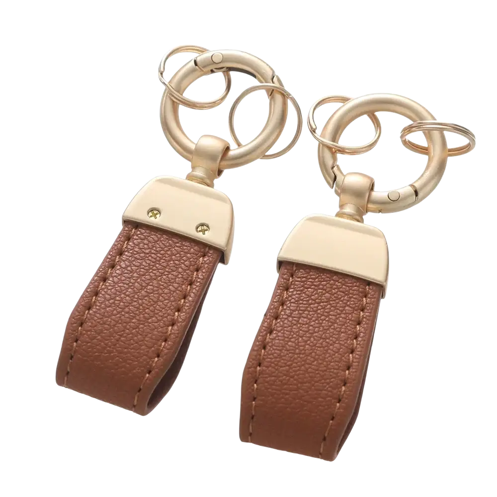Brown leather french sheepskin car keychain with gold-tone metal rings and rectangular plates for key holding
