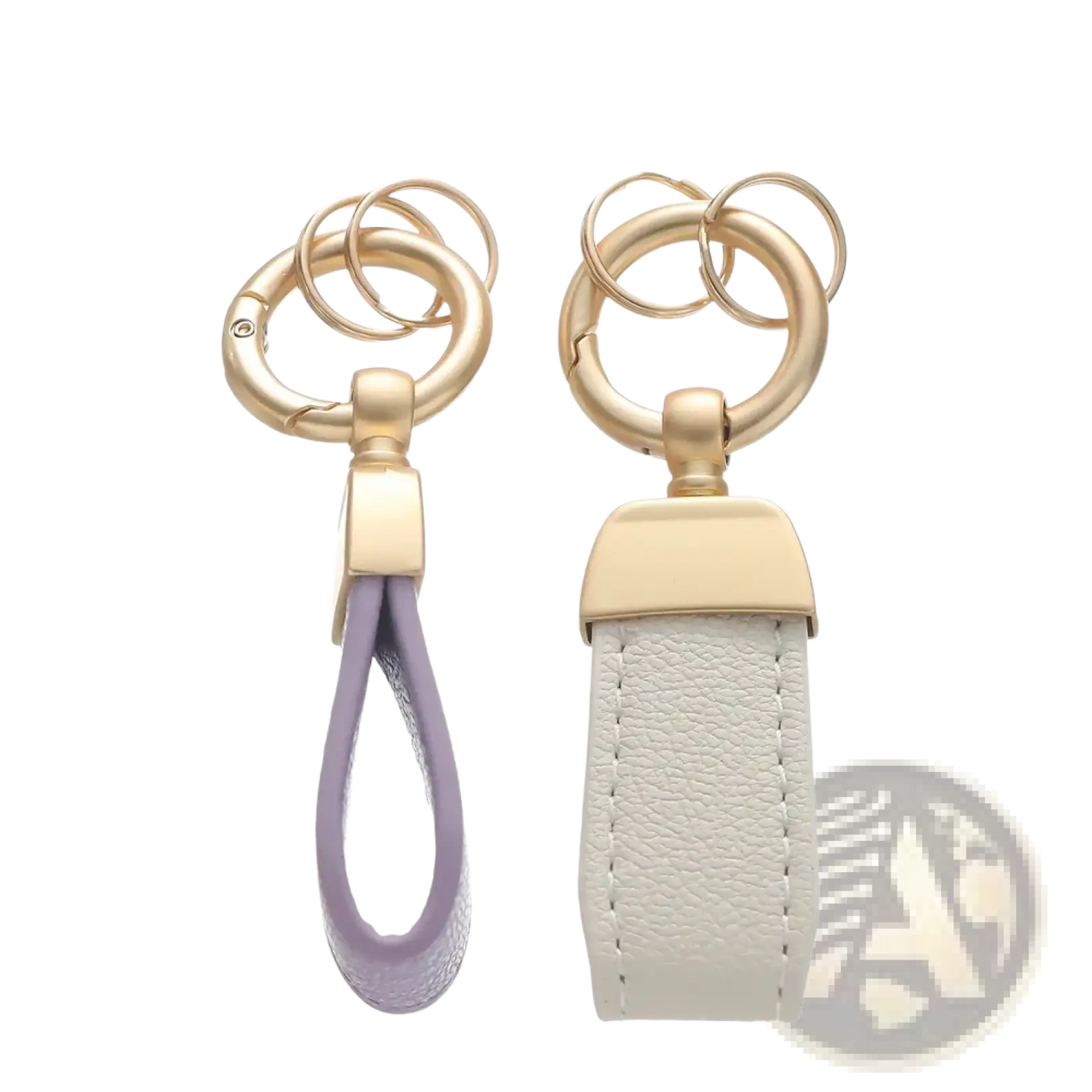 Two french sheepskin leather car keychain holders with lavender and off-white straps and gold-toned metal rings and clasps
