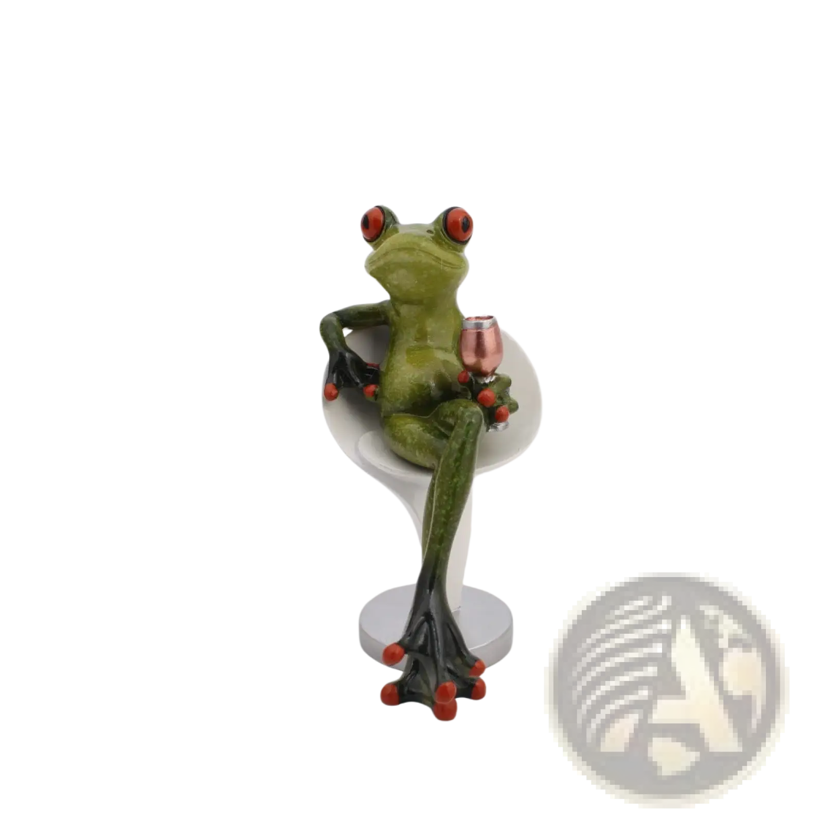 Green frog resin figurine with red eyes and orange toe pads seated in white wine glass holding rose gold miniature glass