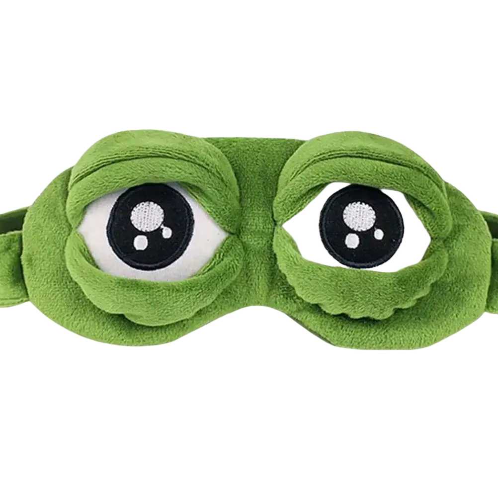 Green plush frog sleep mask finished goods featuring oversized embroidered pepe meme eyes with black pupils and white sclera