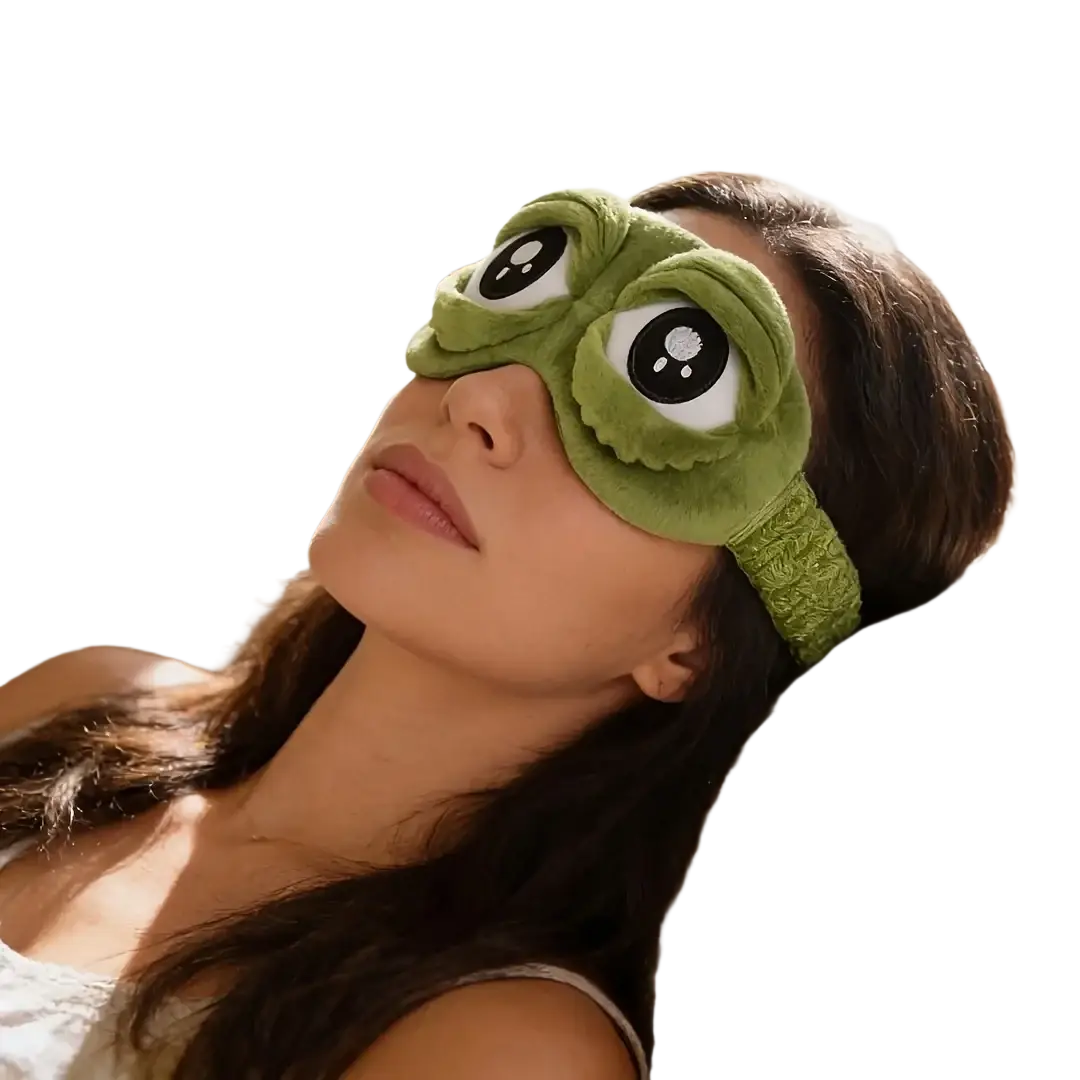 Green plush frog-shaped sleep mask with embroidered eyes and textured headband finished goods for comfortable use
