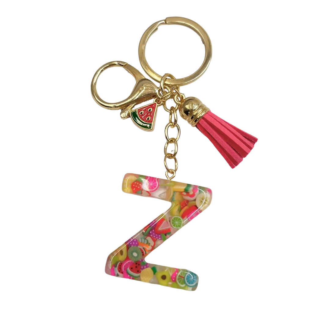 A vibrant translucent resin letter z keychain with colorful fruit slice charms and a pink tassel accessory