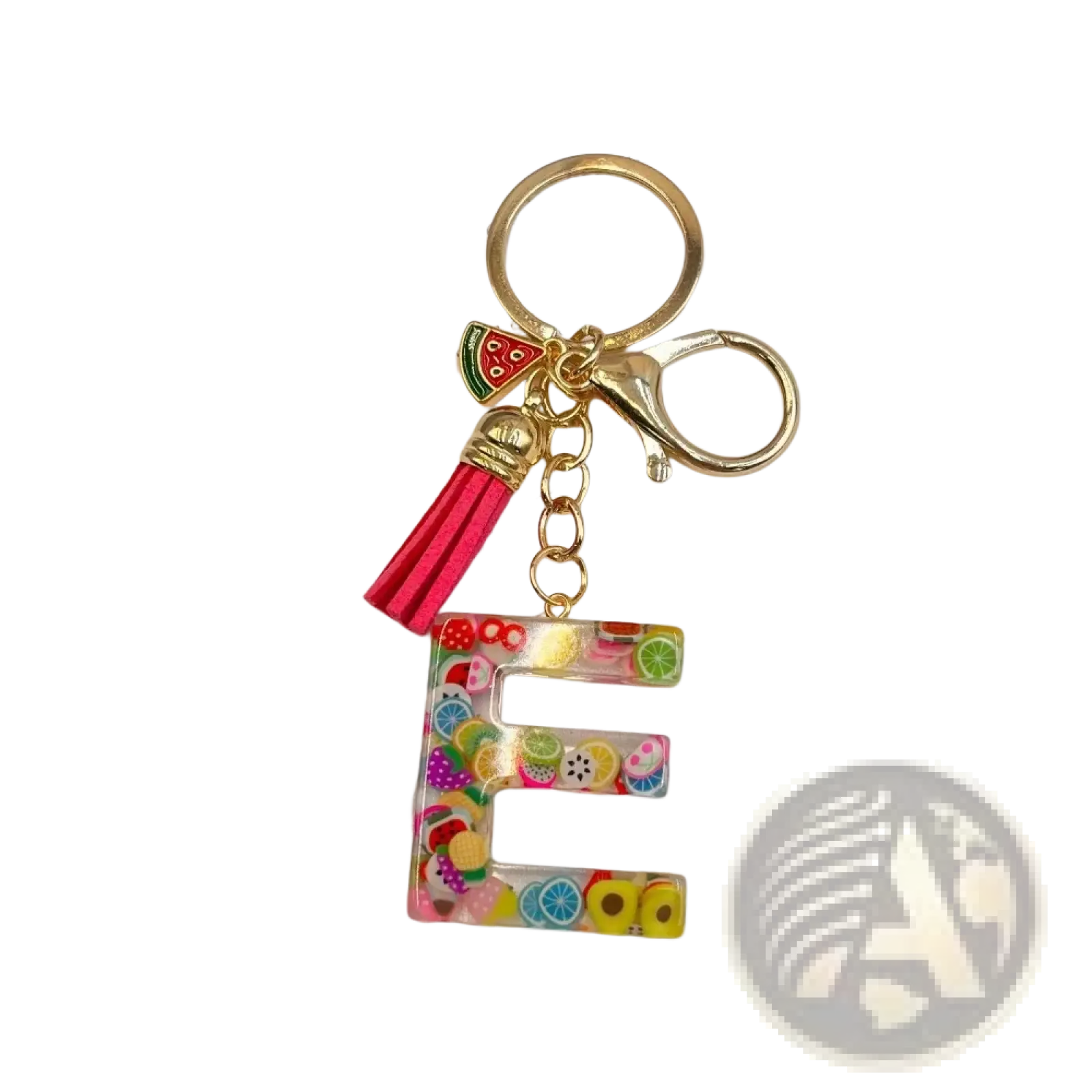 A vibrant transparent resin keychain letter e with colorful fruit slices and gold ring clasp with pink tassel