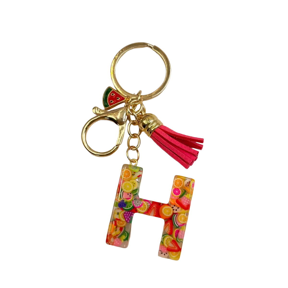 A vibrant translucent resin letter h keychain with colorful fruit slices, gold ring, clasp, and pink tassel
