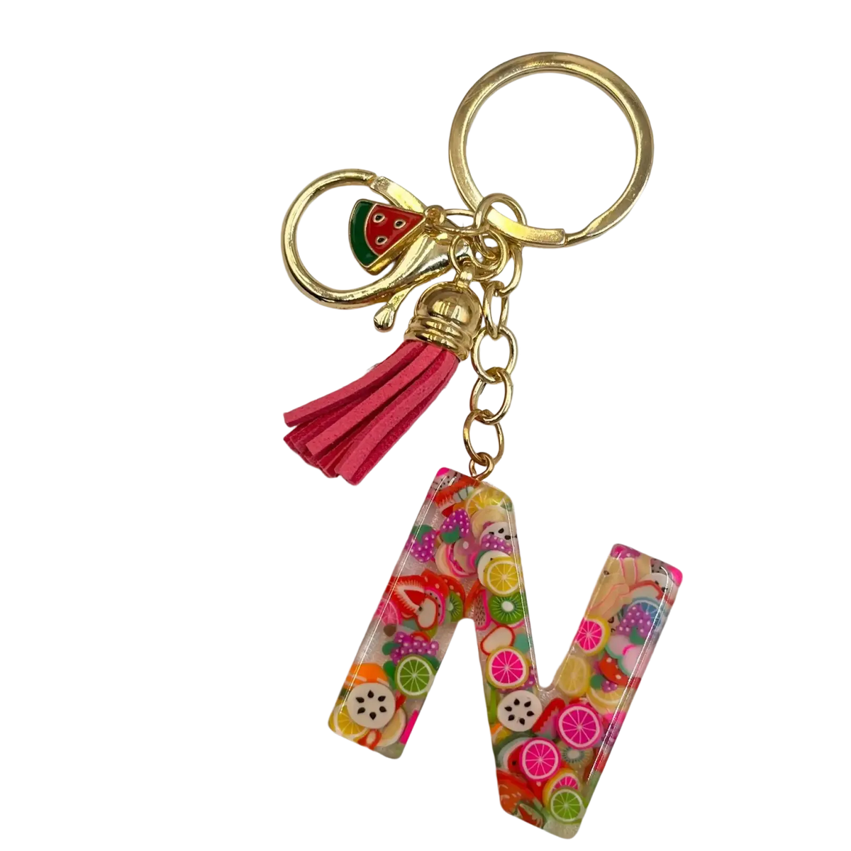 A vibrant translucent resin keychain letter w with colorful fruit slices gold ring pink tassel and watermelon charm