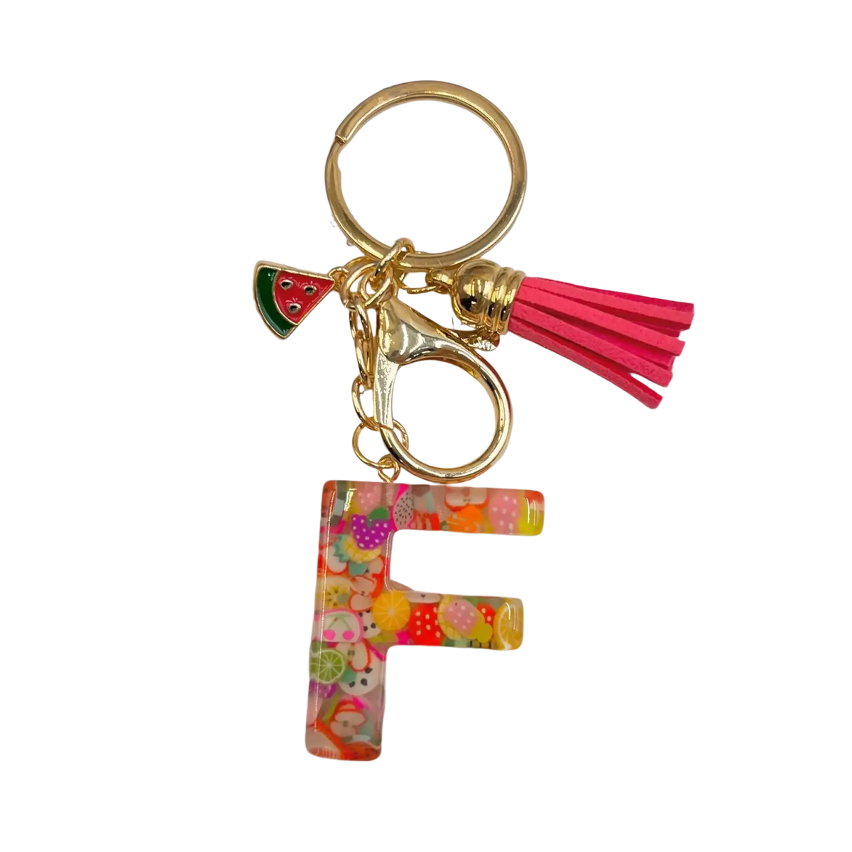 A vibrant translucent resin letter f keychain with colorful fruit pattern and gold-tone metal hardware