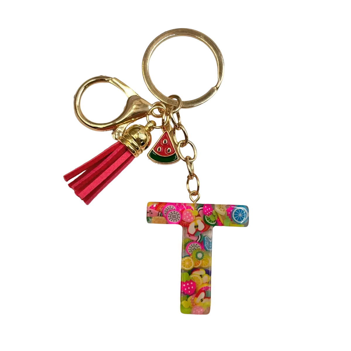 A vibrant translucent resin letter t keychain with colorful fruit slice patterns and gold-toned ring with tassel