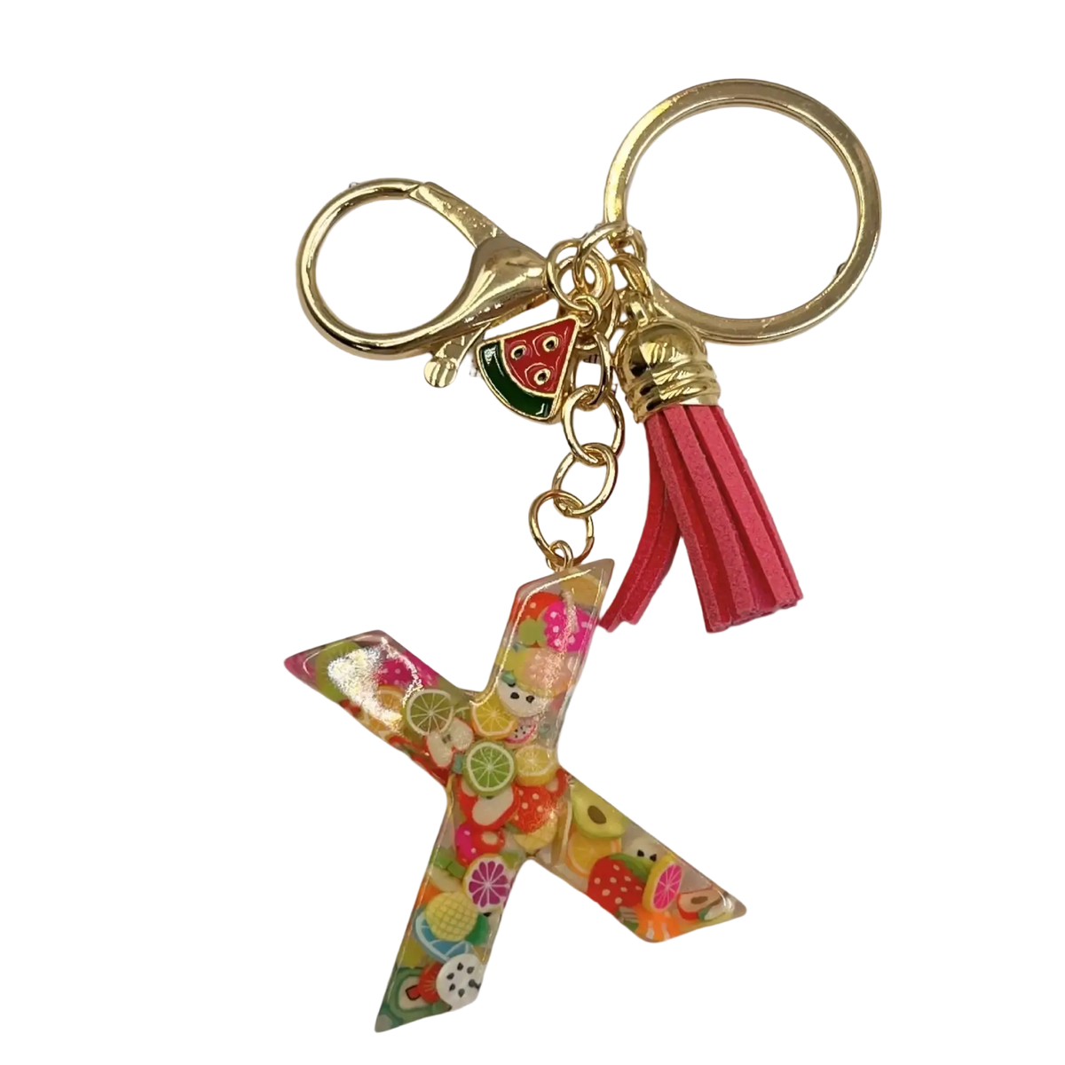 A vibrant translucent resin keychain shaped like letter x with colorful fruit slices in glossy finish