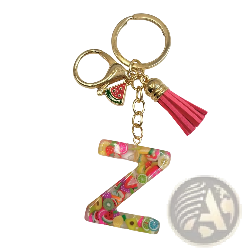 A vibrant translucent resin letter z keychain with colorful fruit slice charms and a pink tassel accessory