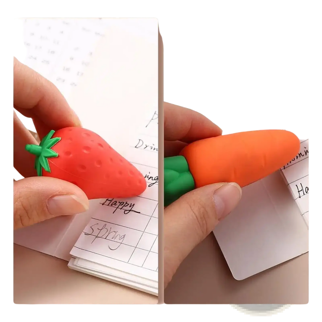 Fruit pencil erasers set featuring red strawberry and orange carrot shapes with green leafy tops for student stationery use