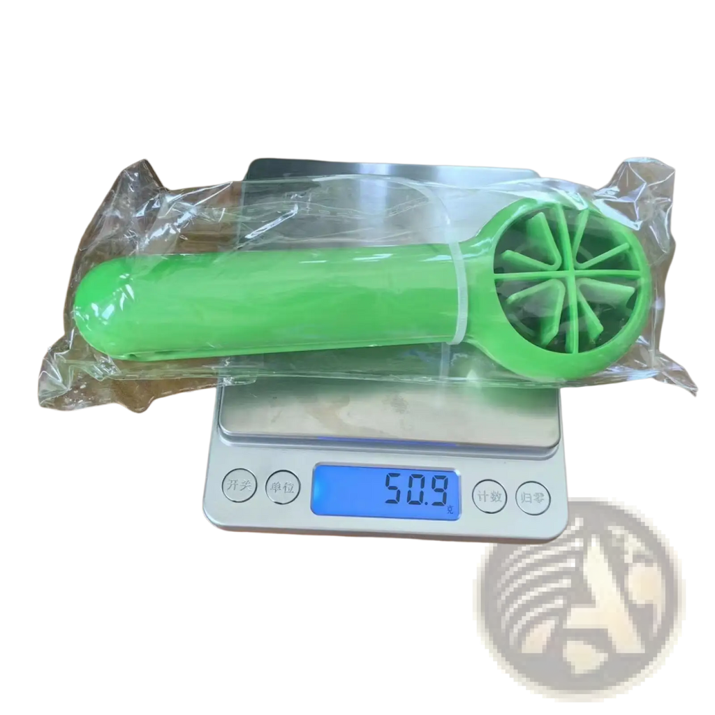 Bright green plastic citrus reamer with circular fan-like blade design for fruit slicer and juicer kitchen tool set