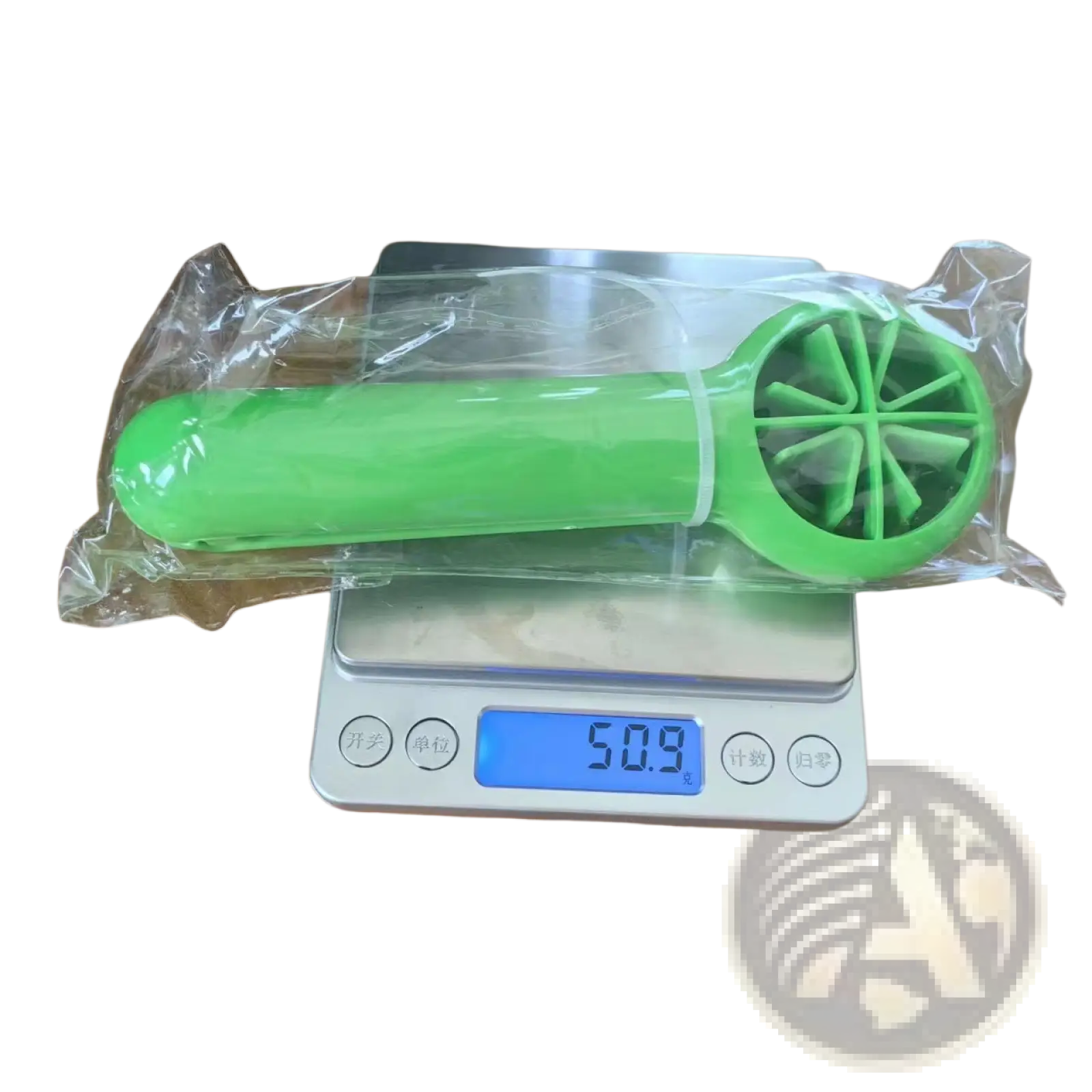 Bright green plastic citrus reamer with circular fan-like blade design for fruit slicer and juicer kitchen tool set