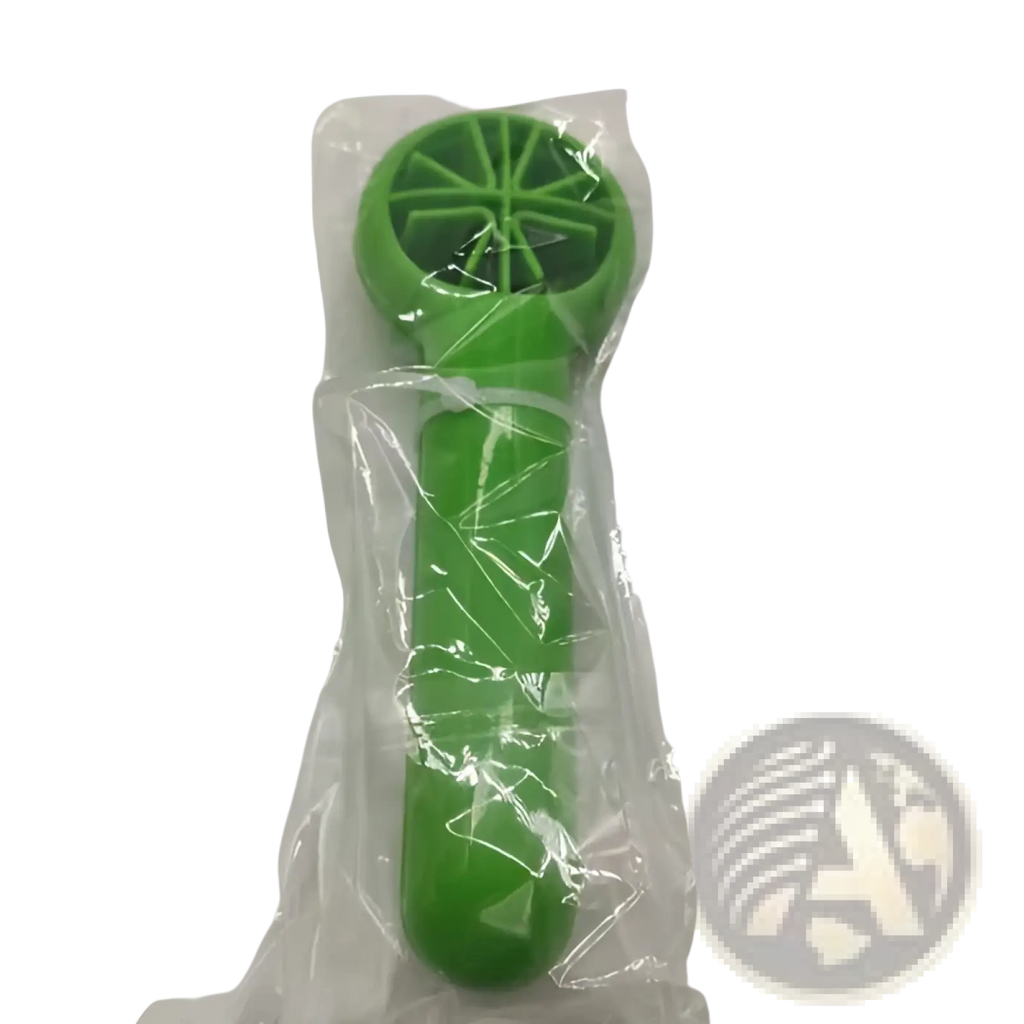 Green plastic citrus reamer with circular segmented head and handle from fruit slicer and citrus juicer kitchen tool set