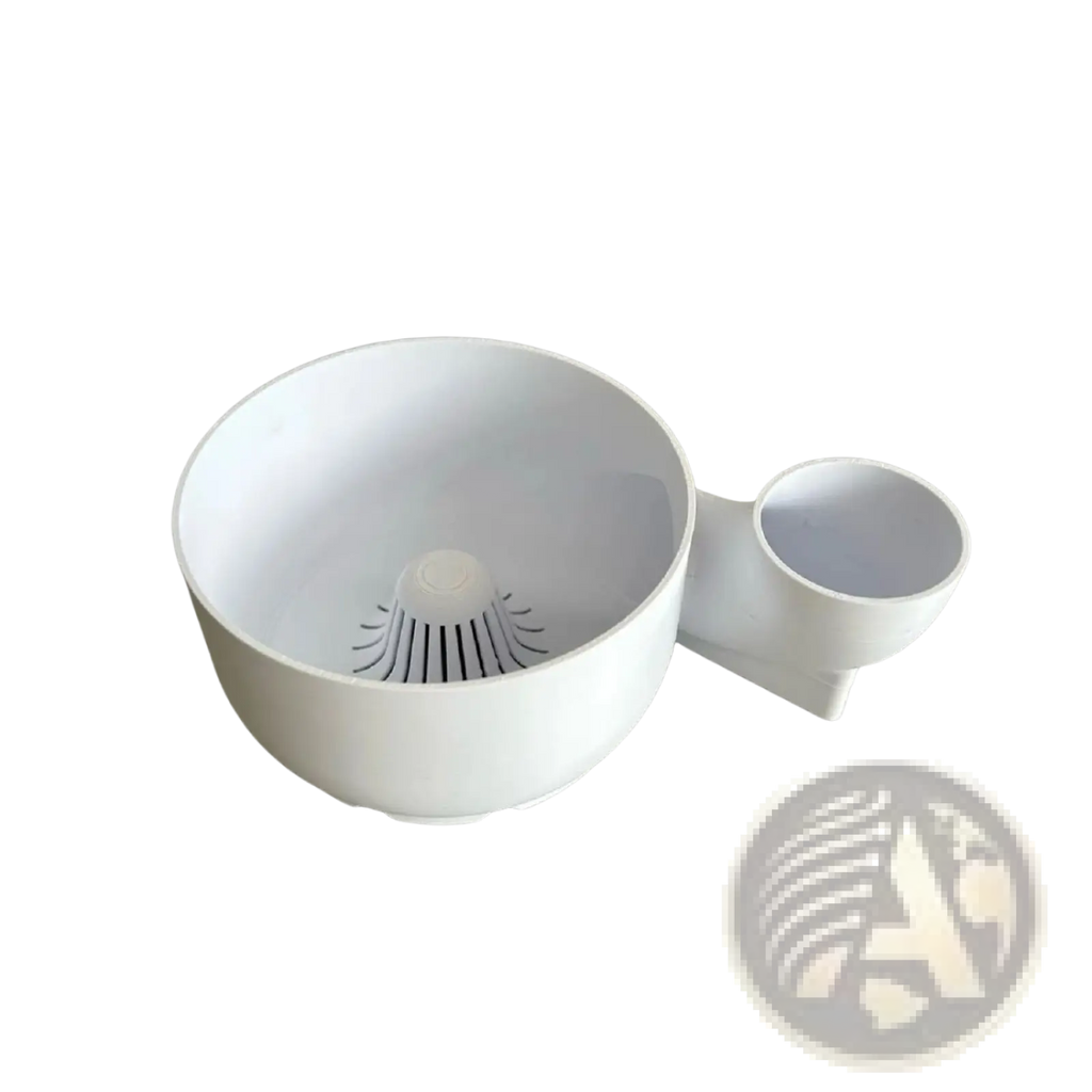 White plastic colander with integrated measuring cup attachment in fruit washing bowl and citrus juicer set