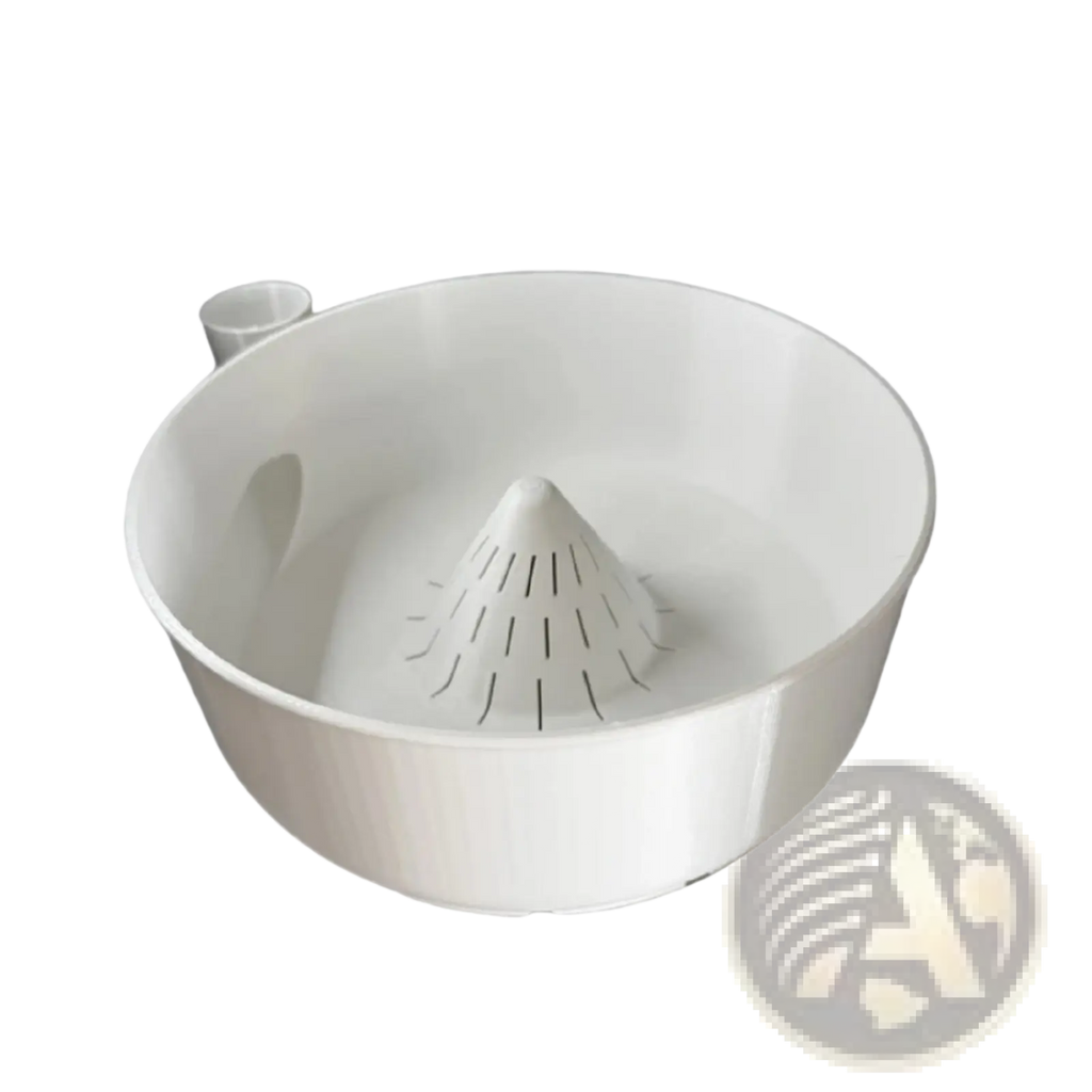 White plastic citrus juicer with conical slotted reamer and integrated spout in fruit washing bowl and citrus juicer set