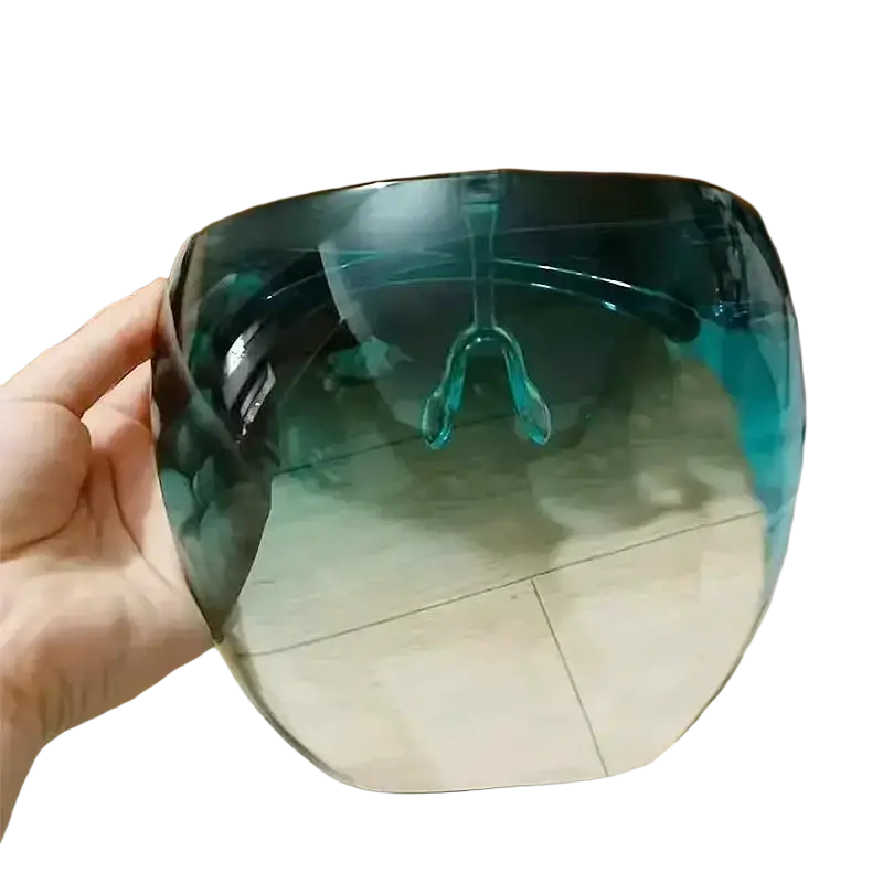 A sleek translucent teal full face safety glasses shield with curved design and integrated nose bridge for protection glasses