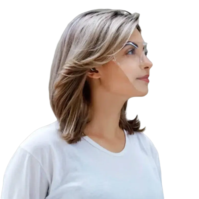 A woman with shoulder-length blonde and brown hair wearing safety glasses with a full face protective shield mask