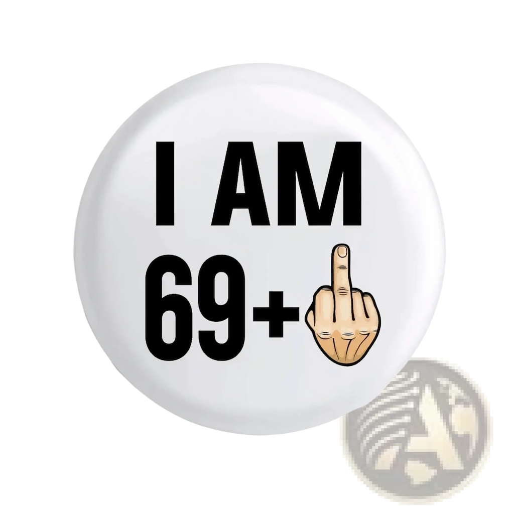 White circular enamel pin badge with black text i am 69 plus and cartoon hand making an obscene gesture for birthday gift