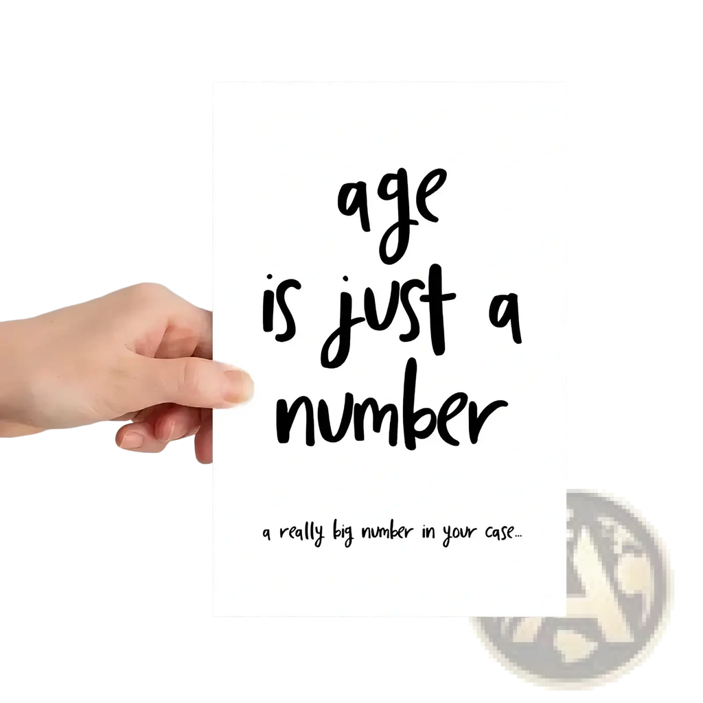 White rectangular funny age is just a number birthday card with black cursive and smaller text on the front