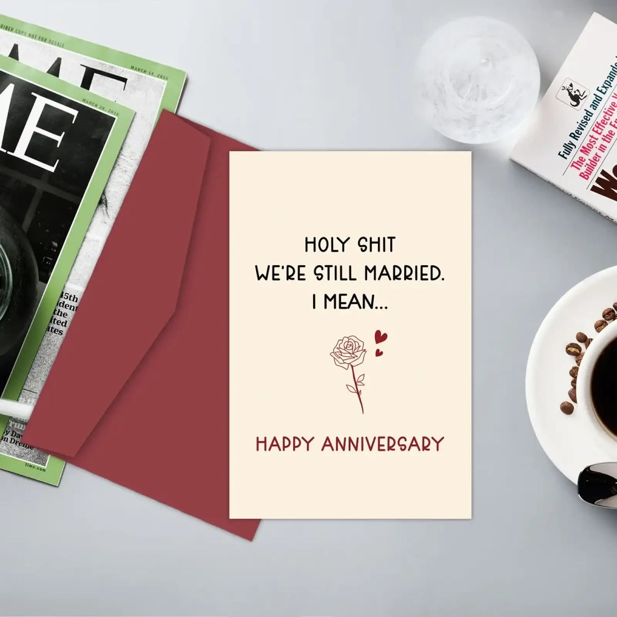 Cream-colored funny anniversary card for husband with black and maroon text and simple rose line drawing