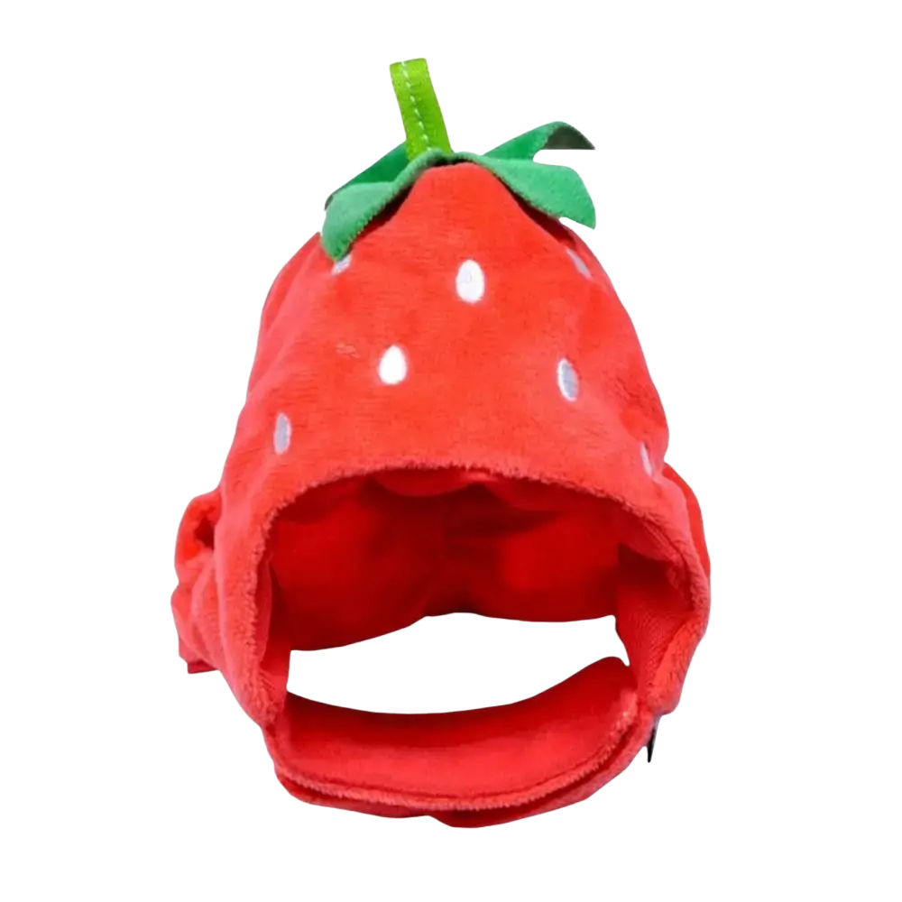 A plush red fruit shape cat funny hat designed as a strawberry with white seed dots and a green leafy top