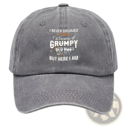 A faded gray denim cotton baseball cap with a funny embroidered quote in white and orange lettering