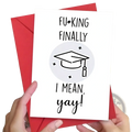 White greeting card with black text and gray graduation cap illustration held against a red envelope for graduation