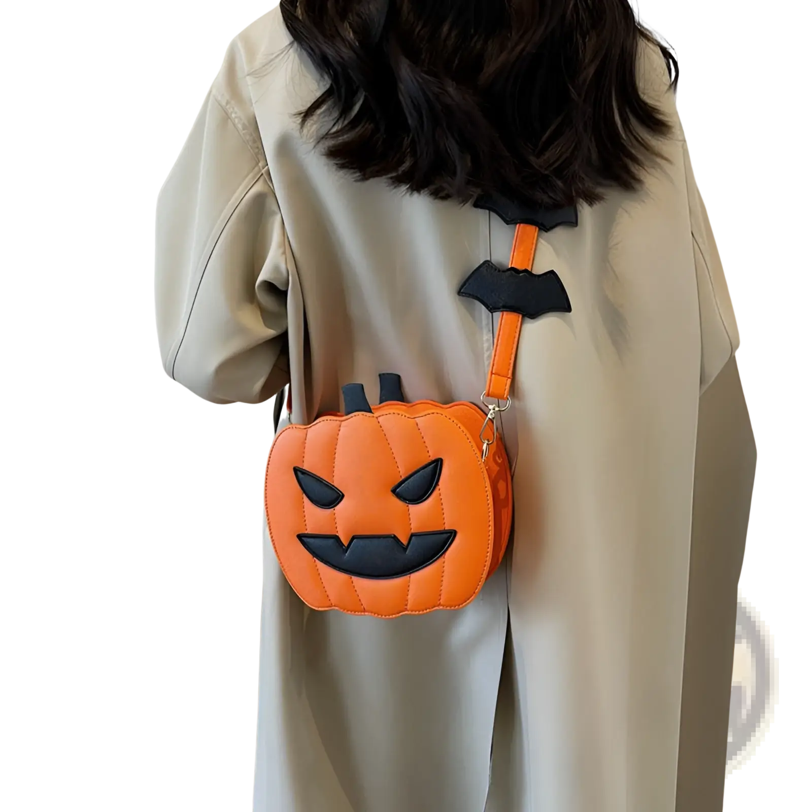 Orange quilted pumpkin-shaped crossbody bag with black embroidered face and matching strap featuring two black bat clips