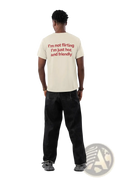Cream-colored cotton funny quote t-shirt with short sleeves showing red text on the back