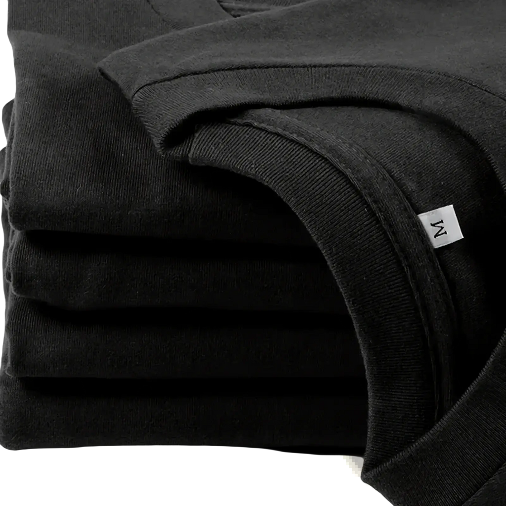 Stack of black cotton funny quote novelty graphic t-shirts with a white medium size tag visible