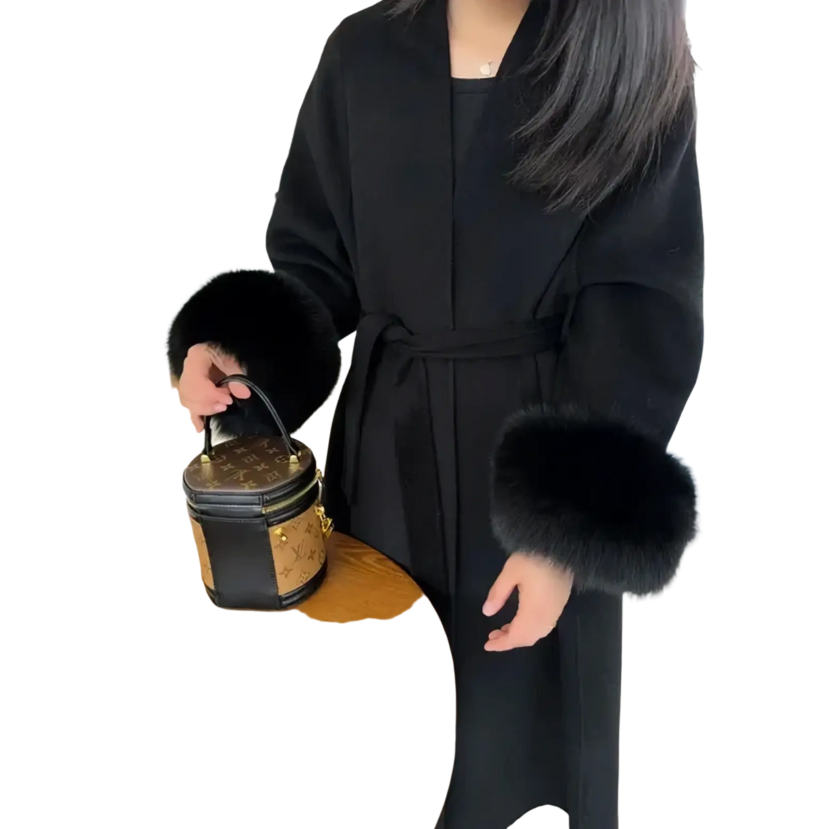 Black and tan monogram canvas bucket bag with gold-tone hardware paired with a fur trim wool coat