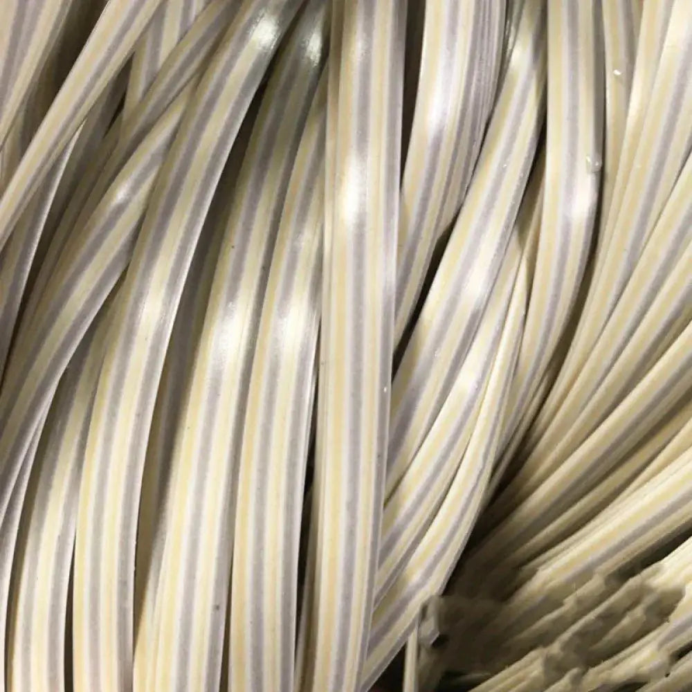 A coiled bundle of beige and gray striped premium rattan wicker repair and decoration plastic cable ties